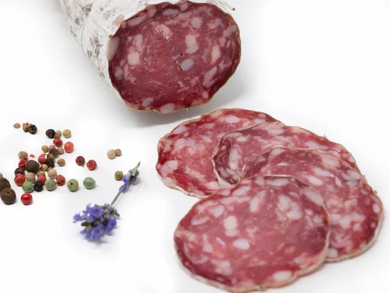 Sliced dry saucisson with peppercorns.